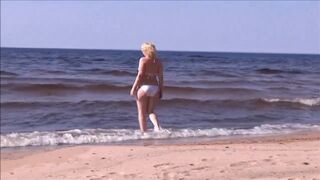 Hot MILF in a white bikini on the beach - 3 image