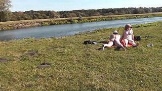 Wild beach. Nudist beach. Outdoors on bank of river lover fucks doggystyle beautiful sexy MILF Frina. Oudoor. Ouside. Naked in public. Sex in public - 1 image