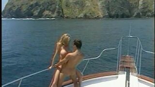 Hung stud gets head on a boat from a sexy blonde then fucks her - 14 image