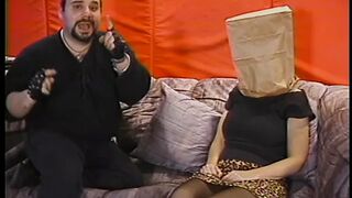 Chubby whore with paper bag on head has her jugs and cunt - 1 image