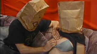 Chubby whore with paper bag on head has her jugs and cunt - 2 image
