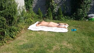 I spy on my stepmother, she is sunbathing naked in the yard