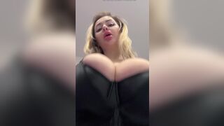 Big natural tits bursting out elastic leather