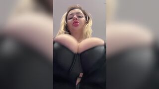 Big natural tits bursting out elastic leather