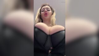 Big natural tits bursting out elastic leather