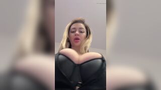 Big natural tits bursting out elastic leather