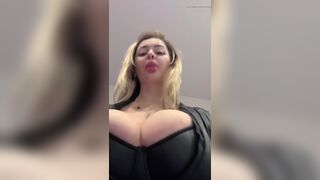 Big natural tits bursting out elastic leather