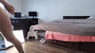 Sexy Latina Having Fun Trying on Clothes and Cutting Them.