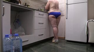 BBW MILF housewife in the kitchen wearing only panties. - 3 image
