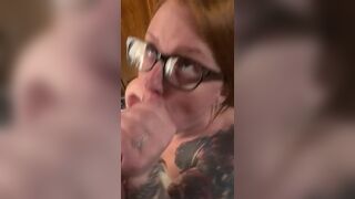 Hot redhead wearing glasses gets a facial - 14 image