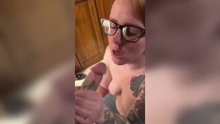 Hot redhead wearing glasses gets a facial - 3 image