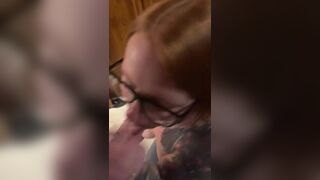 Hot redhead wearing glasses gets a facial - 5 image