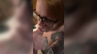 Hot redhead wearing glasses gets a facial - 6 image